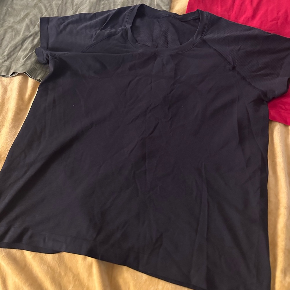 Red and black swiftly tech shirts